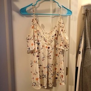 White summer blouse with open pattern and flowers